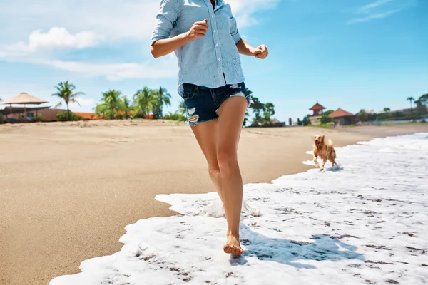 Woman Running With Dog.