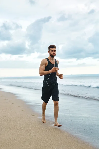 Running Man Jogging At Beach During Fitness Workout Outdoor. Sport