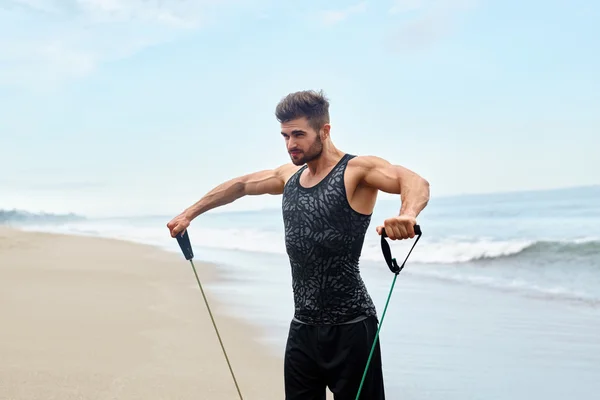 Man Exercising Outdoor, Doing Workout Exercise At Beach. Fitness