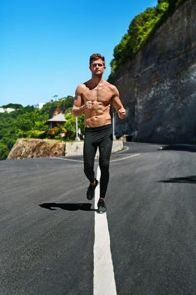 Handsome Muscular Man Running And Exercising Outdoors. Sport, Fitness