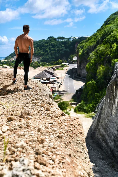 Athletic Muscular Hiker Man On Hill In Summer. Outdoor Sport