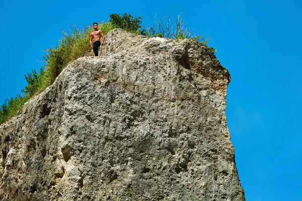 Athletic Muscular Hiker Man On Hill In Summer. Outdoor Sport