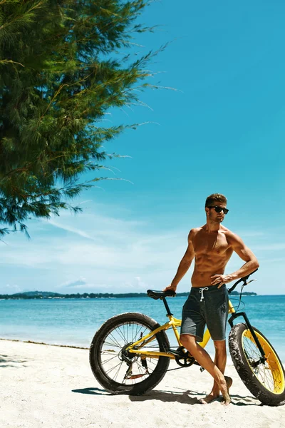 Man With Sand Bike On Beach Enjoying Summer Travel Vacation