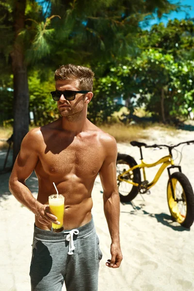Man Drinking Juice Smoothie Cocktail On Summer Beach. Vacation