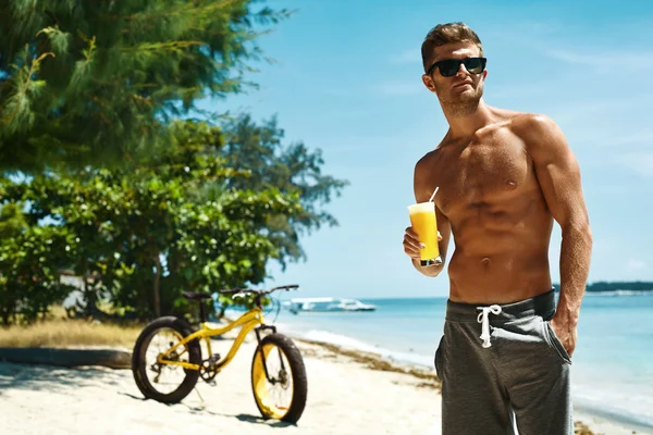 Man Drinking Juice Smoothie Cocktail On Summer Beach. Vacation