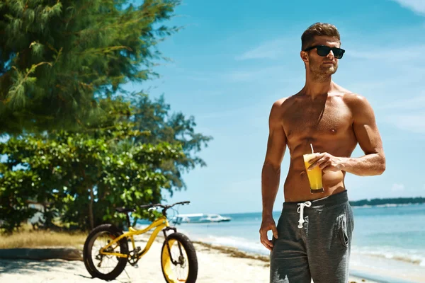 Man Drinking Juice Smoothie Cocktail On Summer Beach. Vacation