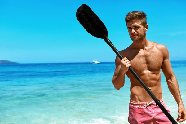 Summer Water Sport. Man With Canoe Kayak Paddle On Beach