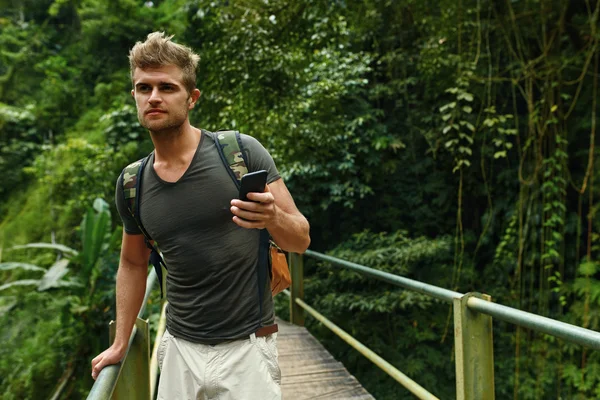 Man Using Mobile Phone, Smartphone In Nature. Travel, Tourism