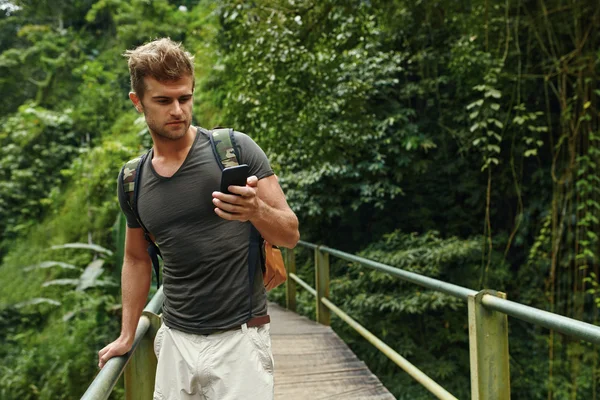 Man Using Mobile Phone, Smartphone In Nature. Travel, Tourism