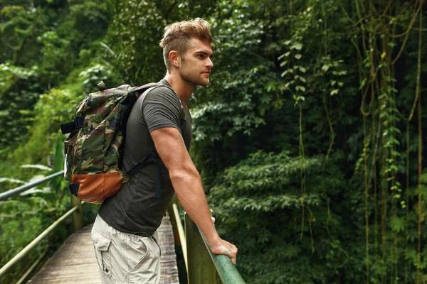 Travel And Tourism. Healthy Tourist Man In Forest In Summer.