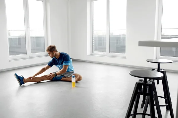 Stretch Exercise. Handsome Healthy Man Stretching Before Workout