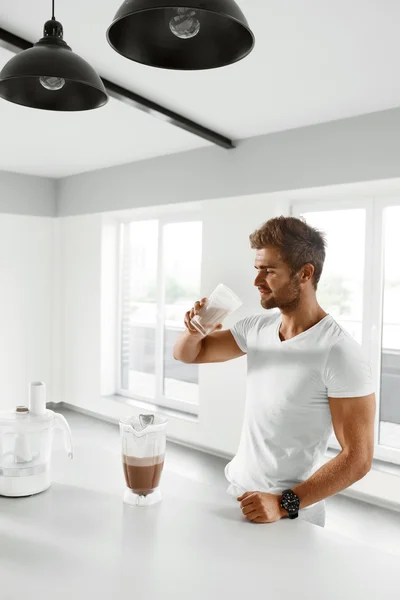 Nutrition Supplements. Man Drinking Protein Shake Before Workout