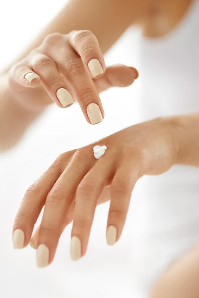 Hand Cream. Close Up Of Woman's Hands Applying Lotion On Skin