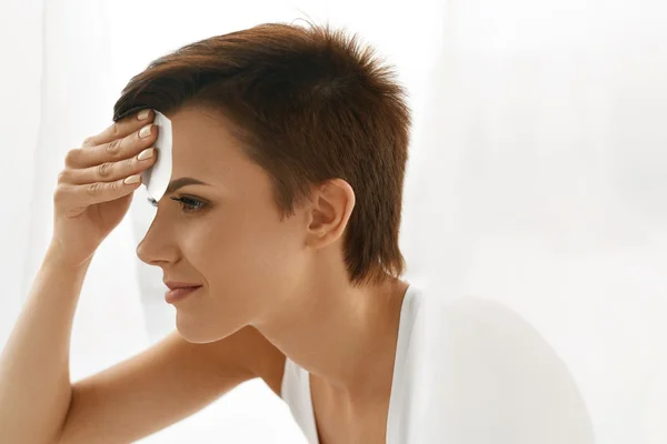 Skin Care. Woman Cleaning Face With Oil Absorbing Papers.