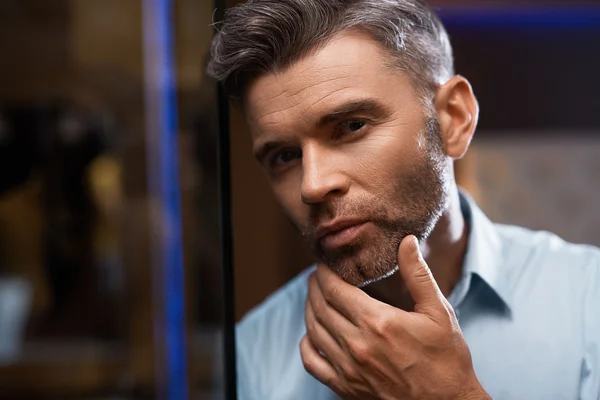 Men Grooming. Handsome Man With Beard Touching Face. Skin Care