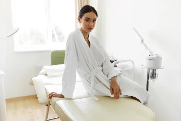 Beautiful Woman In Bathrobe In Cosmetology Room At Spa Salon