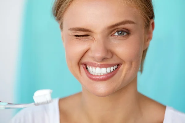 Woman With Beautiful Smile Brushing Healthy White Teeth