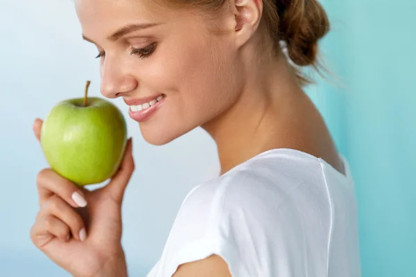 Happy Woman With Beautiful Smile, Healthy Teeth Holding Apple