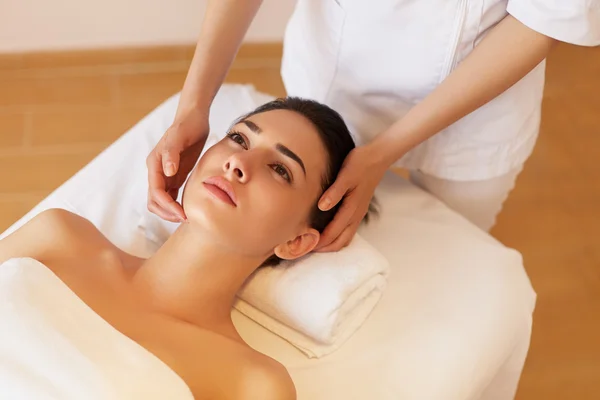 Face Massage. Close-up of a Young Woman Getting Spa Treatment.