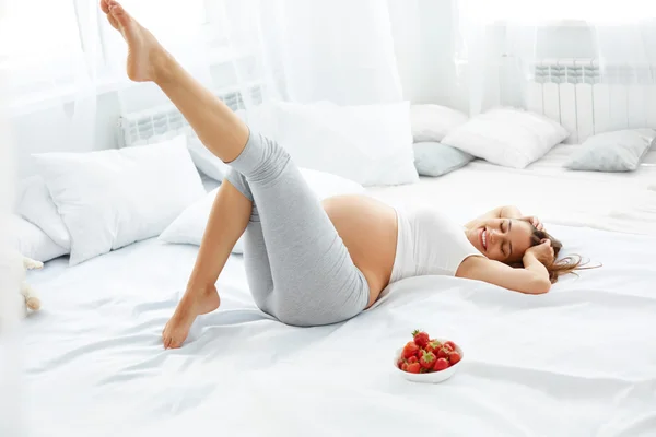 Happy Pregnant Woman Feels Healthy and Gets Some Fun. Healthy Fo