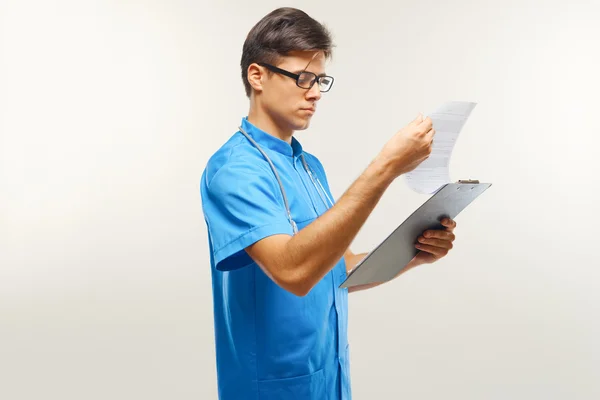 Doctor With Stethoscope Around his Neck Against Grey Background