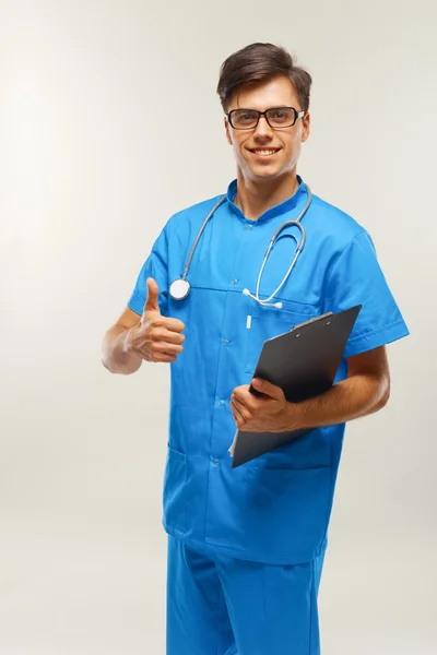 Doctor With Stethoscope Around his Neck Against Grey Background