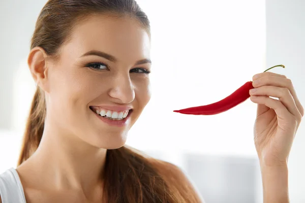 Healthy Food. Smiling Woman Holding Red Chili Pepper.  Lifestyle, Diet.