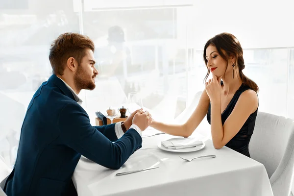 Couple In Love Celebrating. Romantic Dinner In Restaurant. Roman