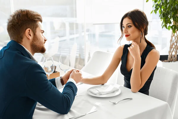 Couple In Love Celebrating. Romantic Dinner In Restaurant. Roman