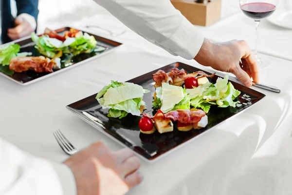 Healthy Food. Couple Eating Caesar Salad For Meal In Restaurant.