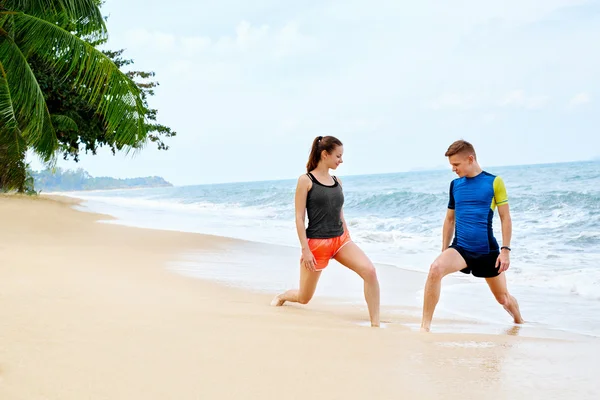 Athletics. Fit Couple Stretching, Exercising On Beach. Sports, F