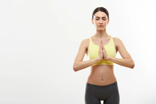 Woman Meditating and Doing Yoga