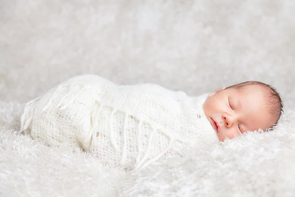 Beautiful newborn wrapped in a blanket