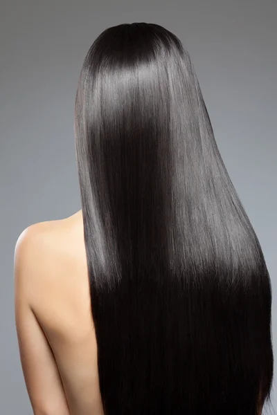 Woman with long straight shiny hair