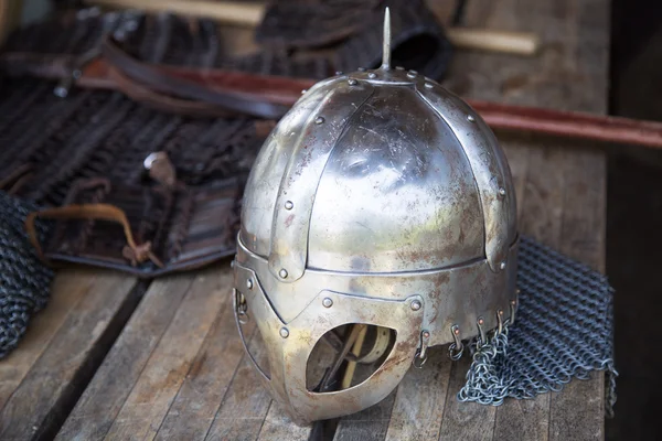 Replika of Vikings helmet on wooden table