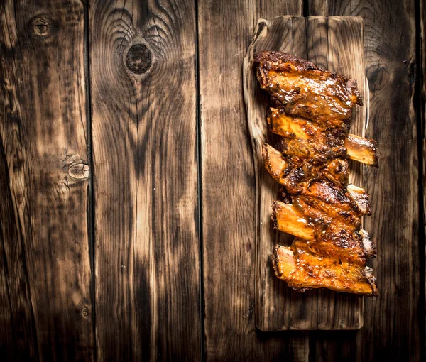 Smoked ribs grilled on the old Board.