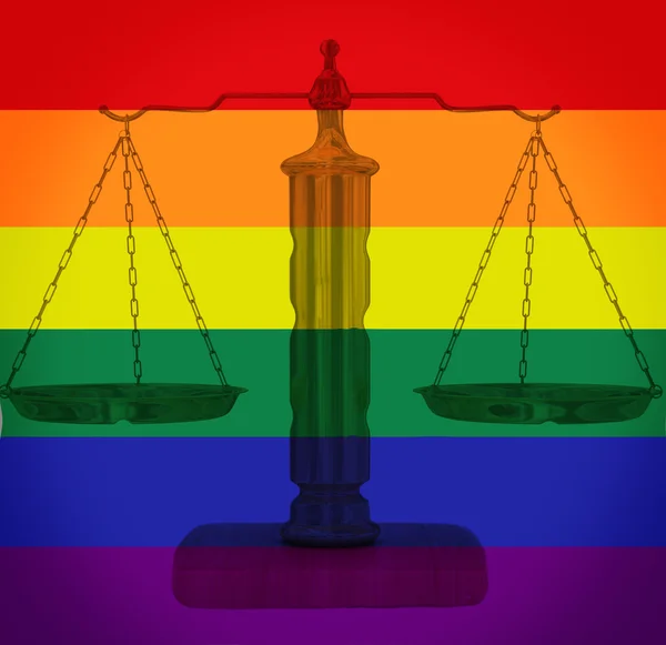 Scales of justice on LGBT rainbow background