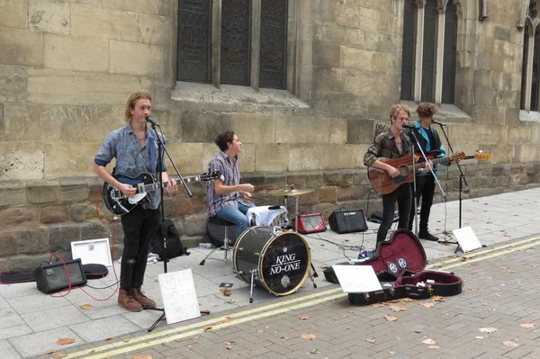 Rock band busking on main street