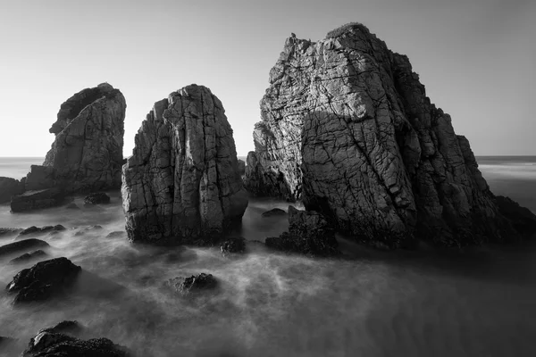 Black and white photo of rocky coastline of Atlantic ocean
