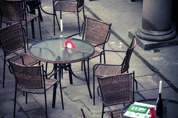 Street cafe terrace with table and chairs in European city