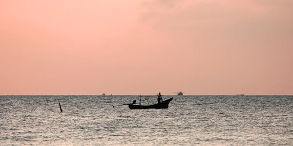 Lonely fisherman\'s boat at sunrise