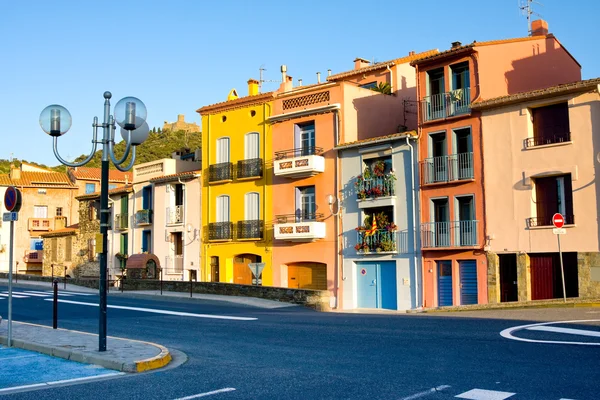 Colourful houses in street and flag of Catalonia, Colliure. Pyrenees-Orientales. Languedoc Roussillon. France