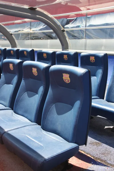 BARCELONA, SPAIN - JUNE 12, 2011: Blue reserve players seats with symbols on Camp Nou Stadium in Barcelona. Camp Nou is the home arena for FC Barcelona and seats 99786 people