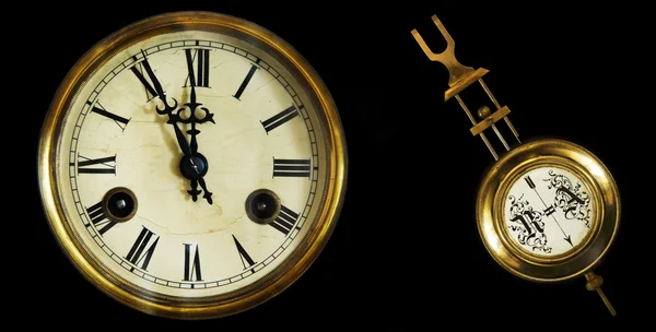 Collection of old clocks and pendulum.