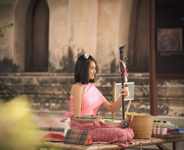 Bangkok, Thailand, February 22,2016: musicians use traditional folk instruments of Thailand. Play for visitors to listen to wat Putthaisawan. Ayutthaya In Bangkok, Thailand