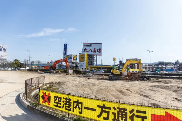 Fukuoka, Japan - March 22, 2016: excavator parked in the road cl