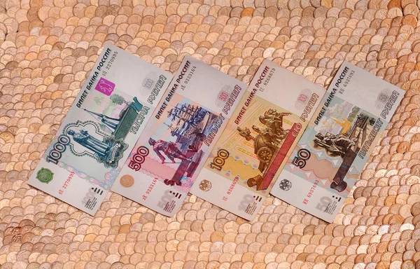 Bank notes on the background of the coins