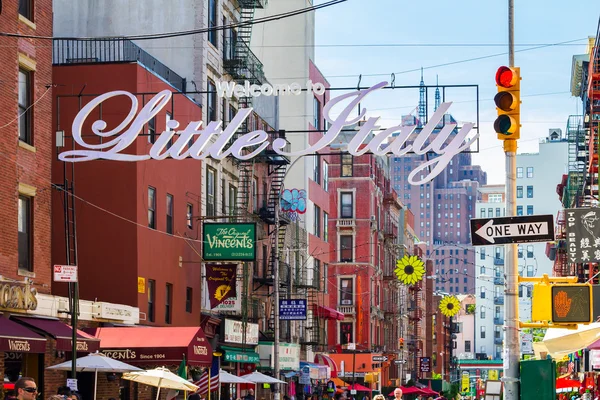 The busy streets of Little Italy are crowded with tourists durin