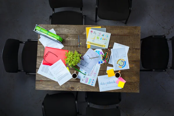 Top view of business objects on wooden table