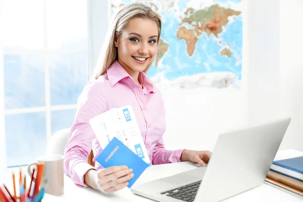 Female travel agent at office